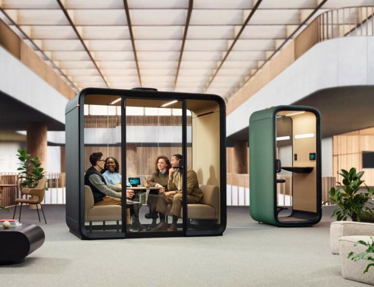 People having a meeting inside a soundproof Framery Four office meeting pod